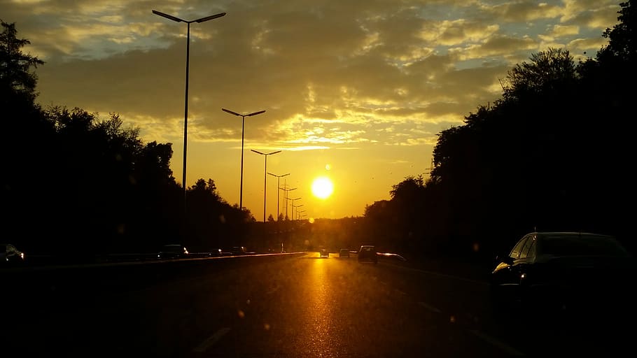 sun, clouds, evening, landscape, road, cars, silhouette, sunset HD wallpaper