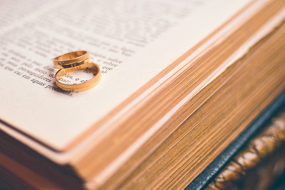 two gold-colored rings on open book, couple, love, religion, marriage, HD wallpaper