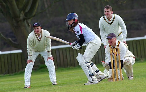 woman holding bat beside three other players, cricket, batting HD wallpaper