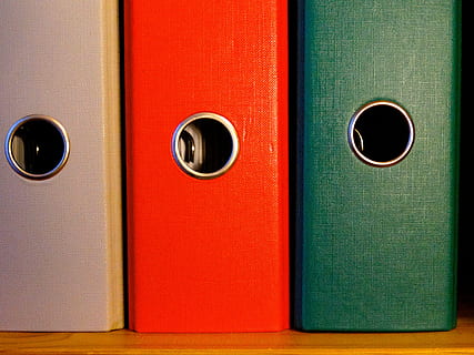 three assorted-color piled cases, folder, federal folder, file HD wallpaper