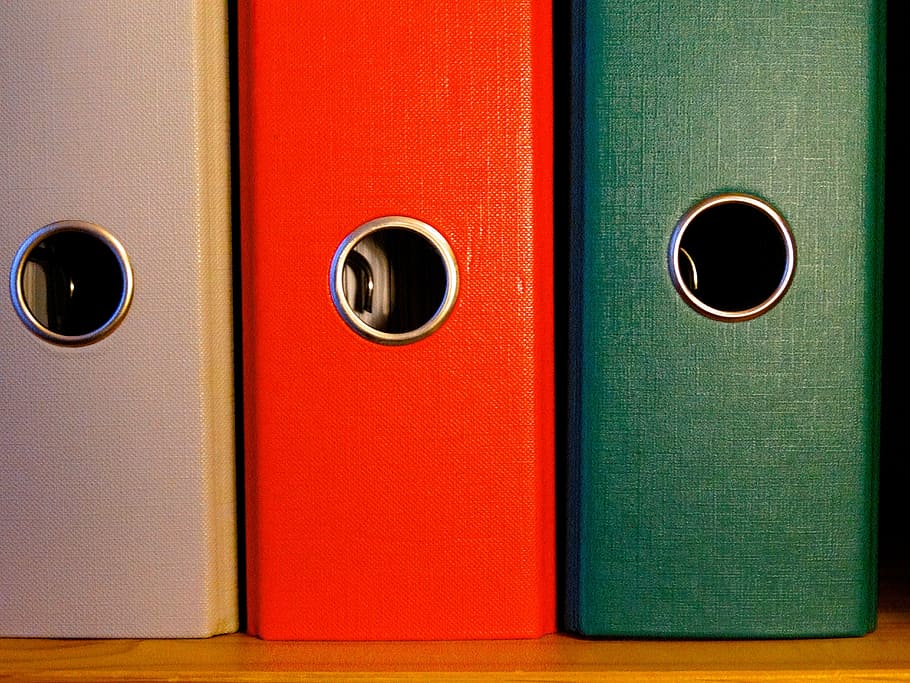three assorted-color piled cases, folder, federal folder, file HD wallpaper