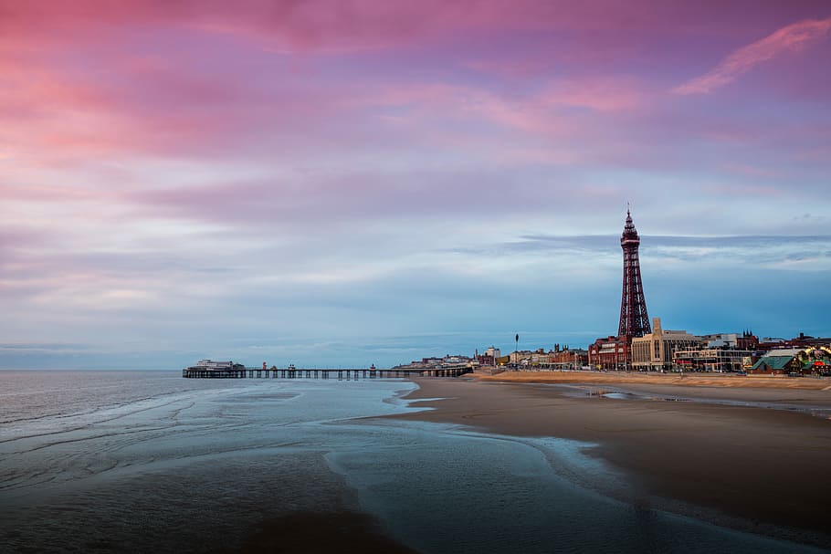 black tower near beach dock during golden hour, photo of seashore during sunset HD wallpaper