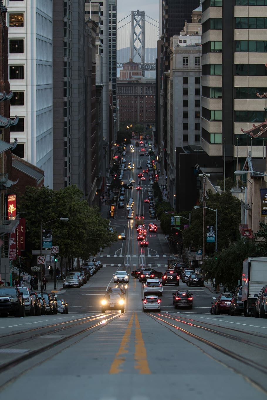 HD wallpaper: photo of roadway between buildings, photo of city street,  traffic | Wallpaper Flare