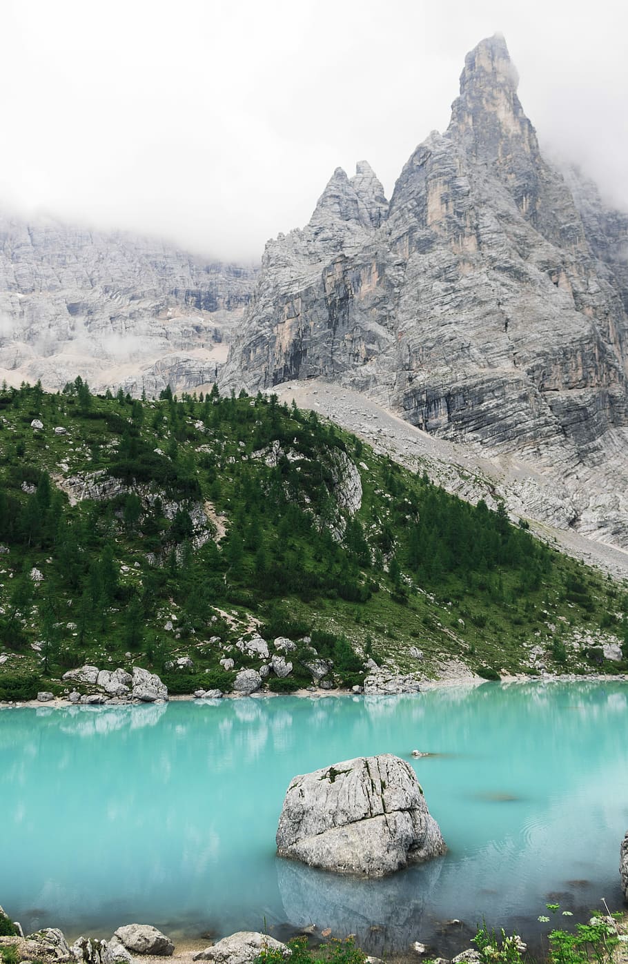 gray mountain near water, body of water near mountain during daytime HD wallpaper