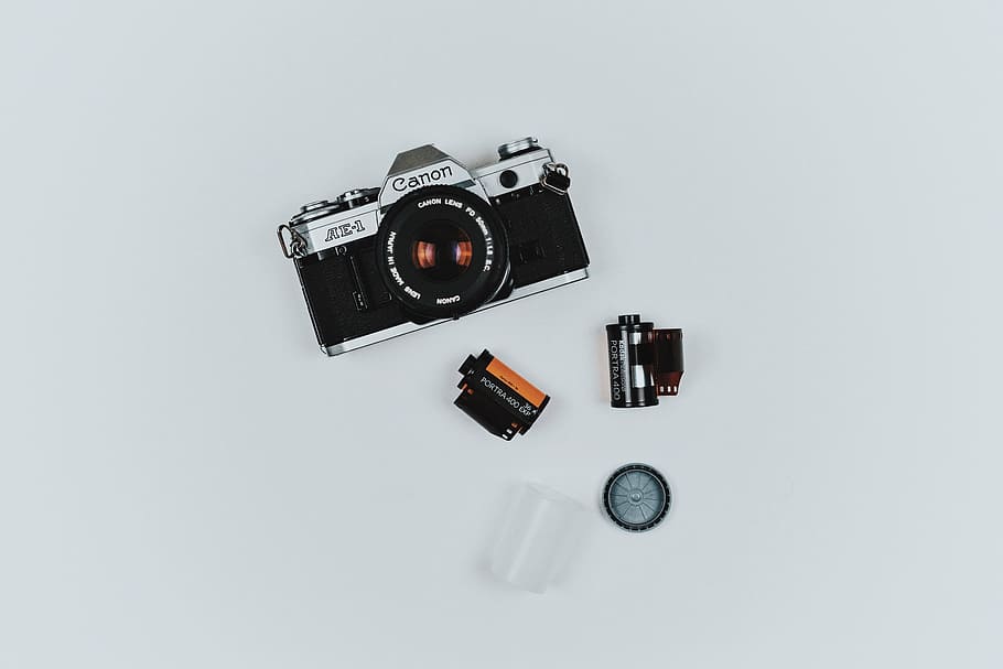 gray Canon film camera beside two black films, lens, accessory, HD wallpaper