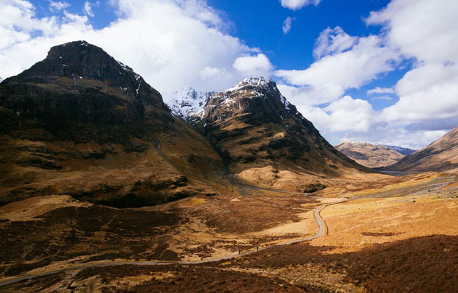 brown mountain under blue sky, brown rocky mountain under white cloudy sky HD wallpaper