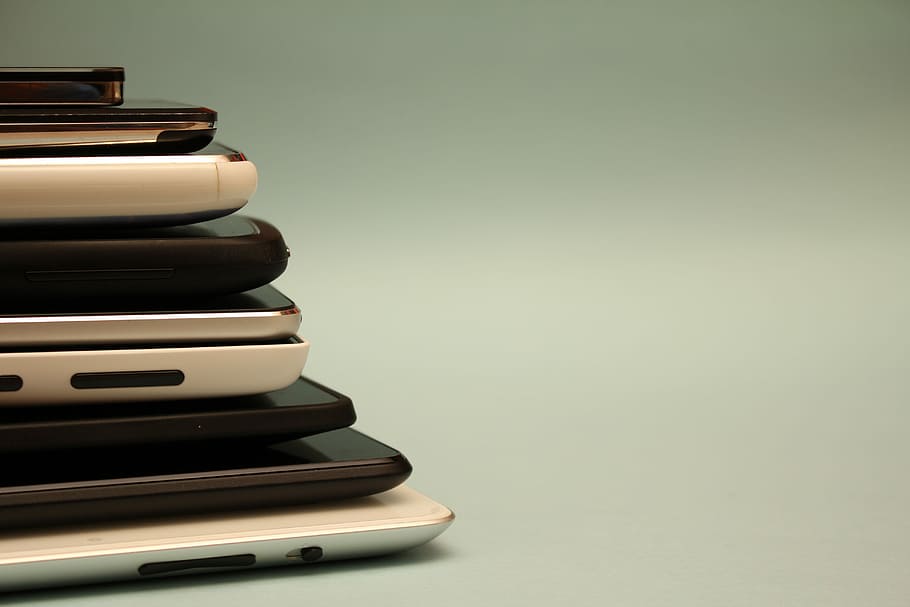 pile of smartphones, assorted Android smartphone lot on white surface HD wallpaper