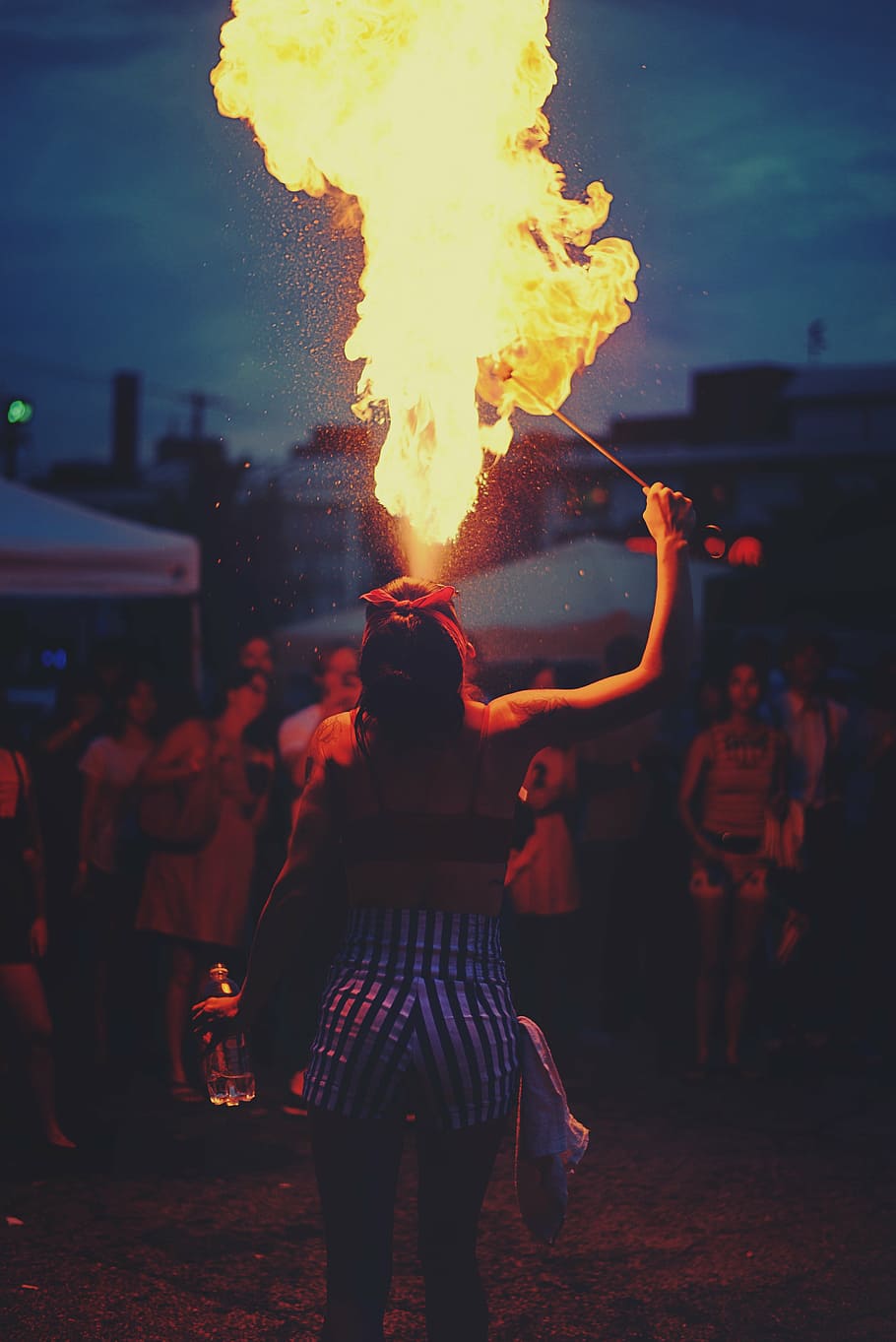woman playing with fire, adult, audience, blur, festival, flame