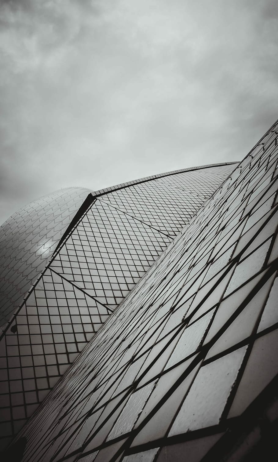 low angle photography of building under cloudy sky, grayscale photography of a building HD wallpaper