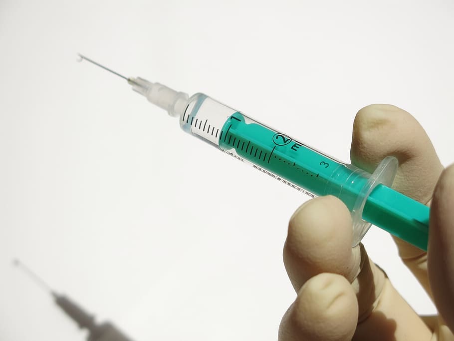 injection with 1 ml liquid, syringe, medical, finger, disposable syringe