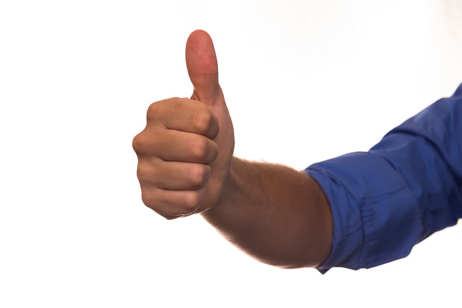 man wears blue dress shirt while doing thumbs up, human, right hand