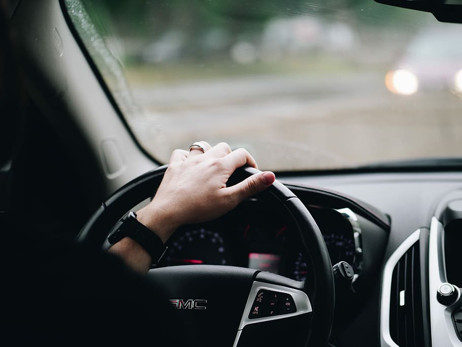 person driving GMC vehicle, car, interior, wheel, hand, caucasian HD wallpaper