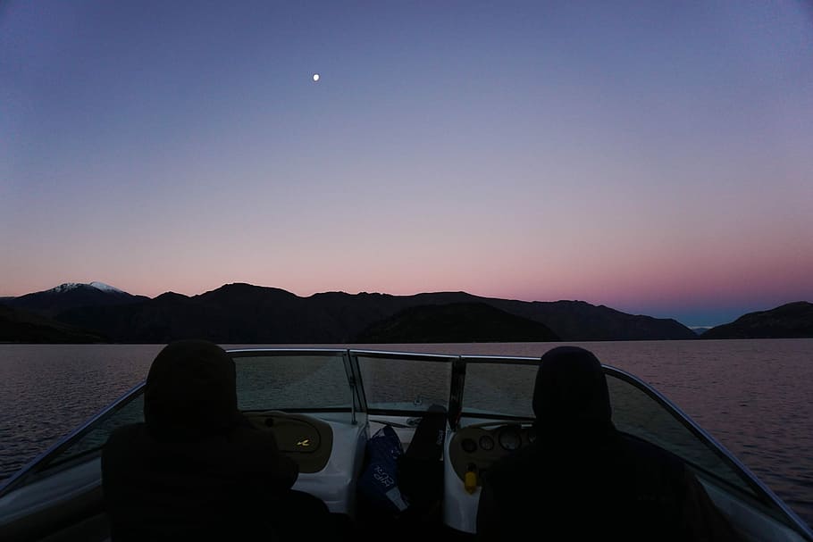 Fishing Aotearoa, two people riding boat at daytime, sky, mountian