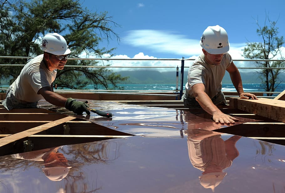 two men placing brown roof sheets on brown wooden panel, spring HD wallpaper