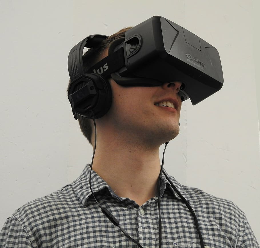 person wearing black Oculus VR headset, man, virtual reality