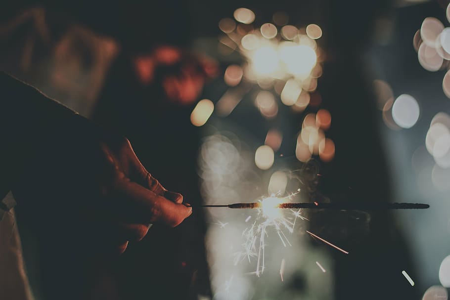 bokeh shot photo, firework, hand, sparkler, adults only, night HD wallpaper