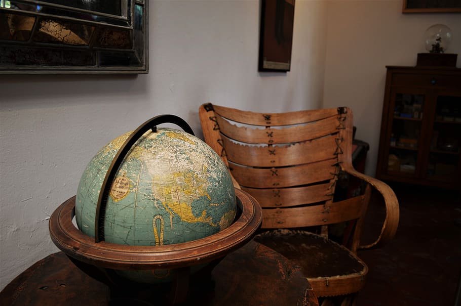 Frida Kahlo House | Study, globe with brown wooden base on top of brown table beside brown armchair, HD wallpaper