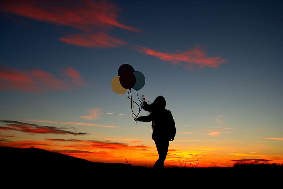 silhouette photo of woman holding a balloons, sunset, girl, shadow