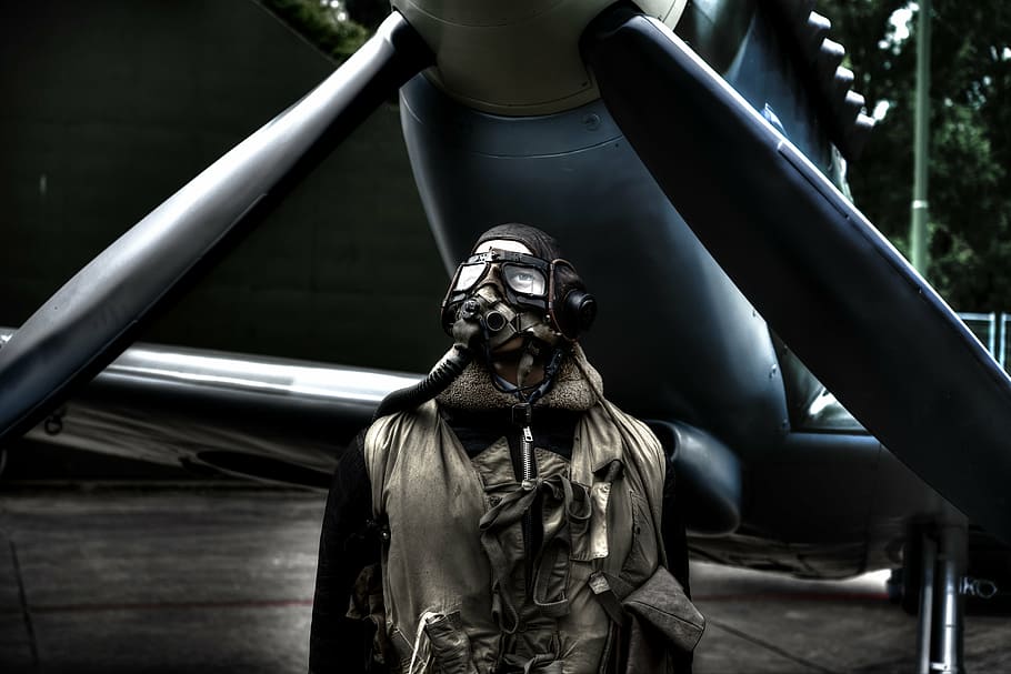 man wearing mask and suit, pilot, standing, plane, airplane HD wallpaper