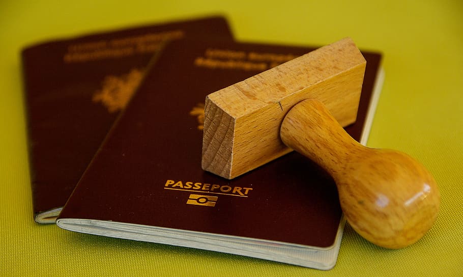brown wooden stamp and two maroon passport, buffer, travel HD wallpaper