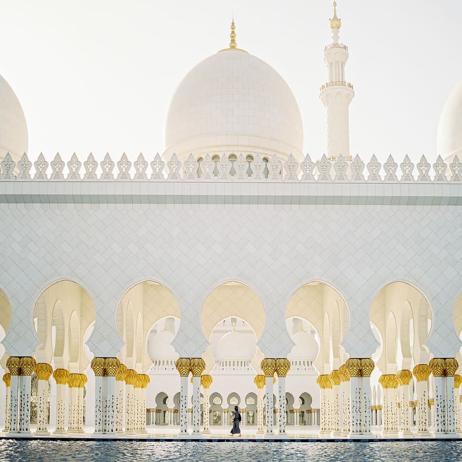 person walking inside white concrete mosque during daytime, white concrete castle HD wallpaper