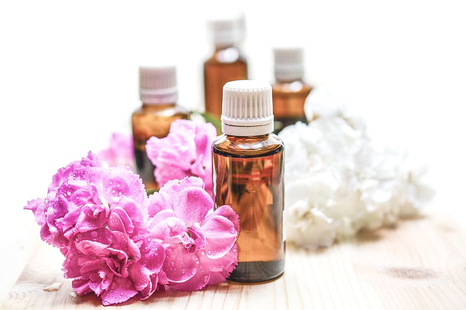 brown glass bottle beside pink flowers, essential oils, alternative, HD wallpaper