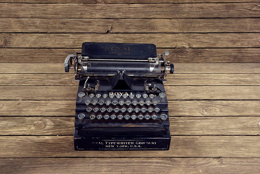 black typewriter on brown surface, vintage, new york, letters