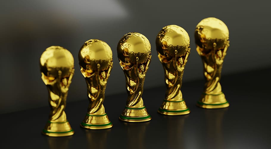 five gold-colored trophies, trophy, soccer, sport, cup, football