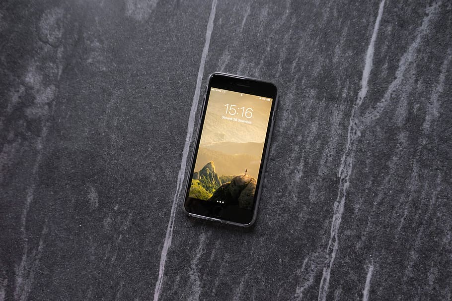 space gray iPhone 6 on tabletop, post 2017 iPhone on grey surface HD wallpaper