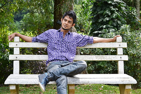 Man in red t-shirt and blue denim jeans sitting on rock photo – Free  Bhubaneswar Image on Unsplash