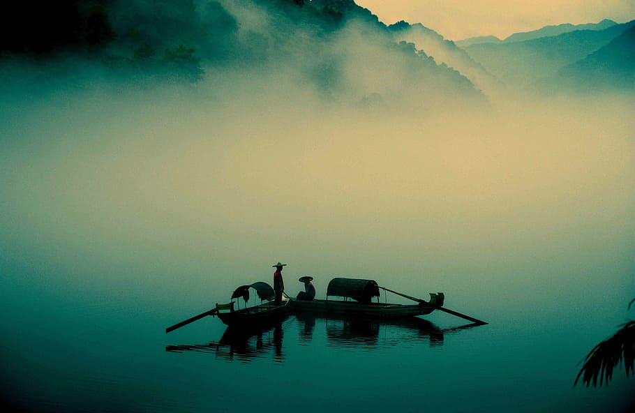 two persons riding on boats, silhouette of people on wooden paddle boats on foggy lake HD wallpaper