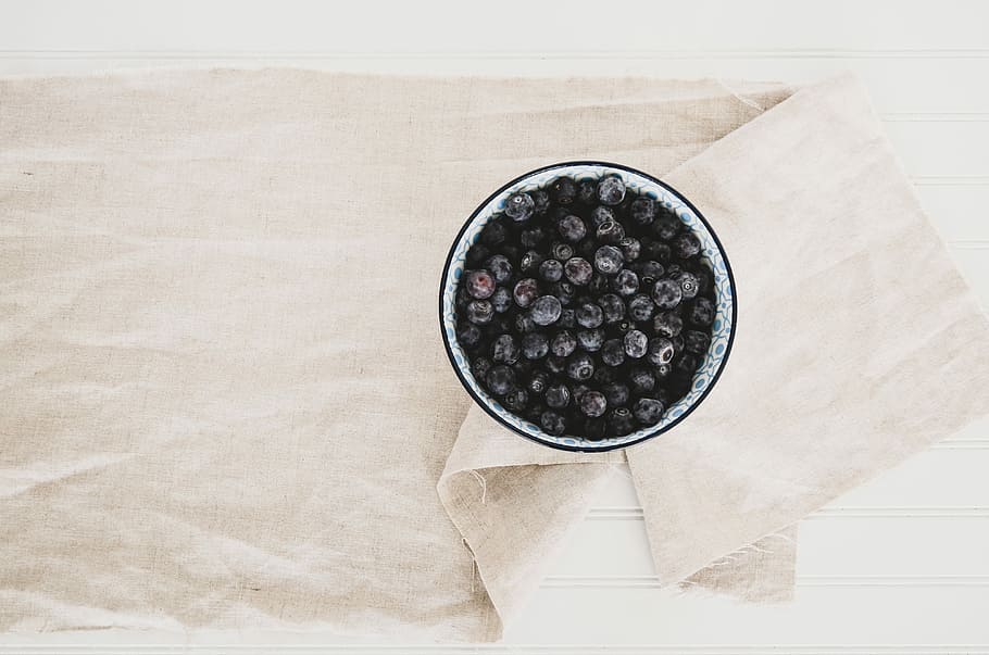 blueberries on gray and black container, white ceramic plate on white textile HD wallpaper