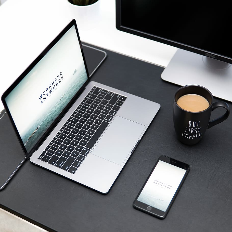 laptop, coffee mug, and iPhone on desk, turned-on laptop beside iPhone and coffee in mug HD wallpaper