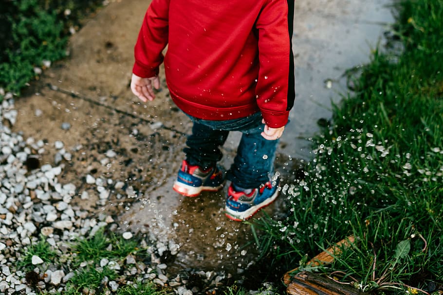 people, child, splash, rain, grass, rocks, low section, one person HD wallpaper