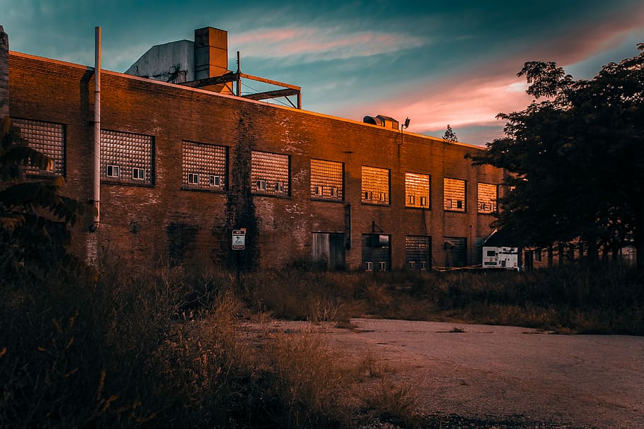 architectural photography of brown brick industrial building, grey and brown concrete building HD wallpaper