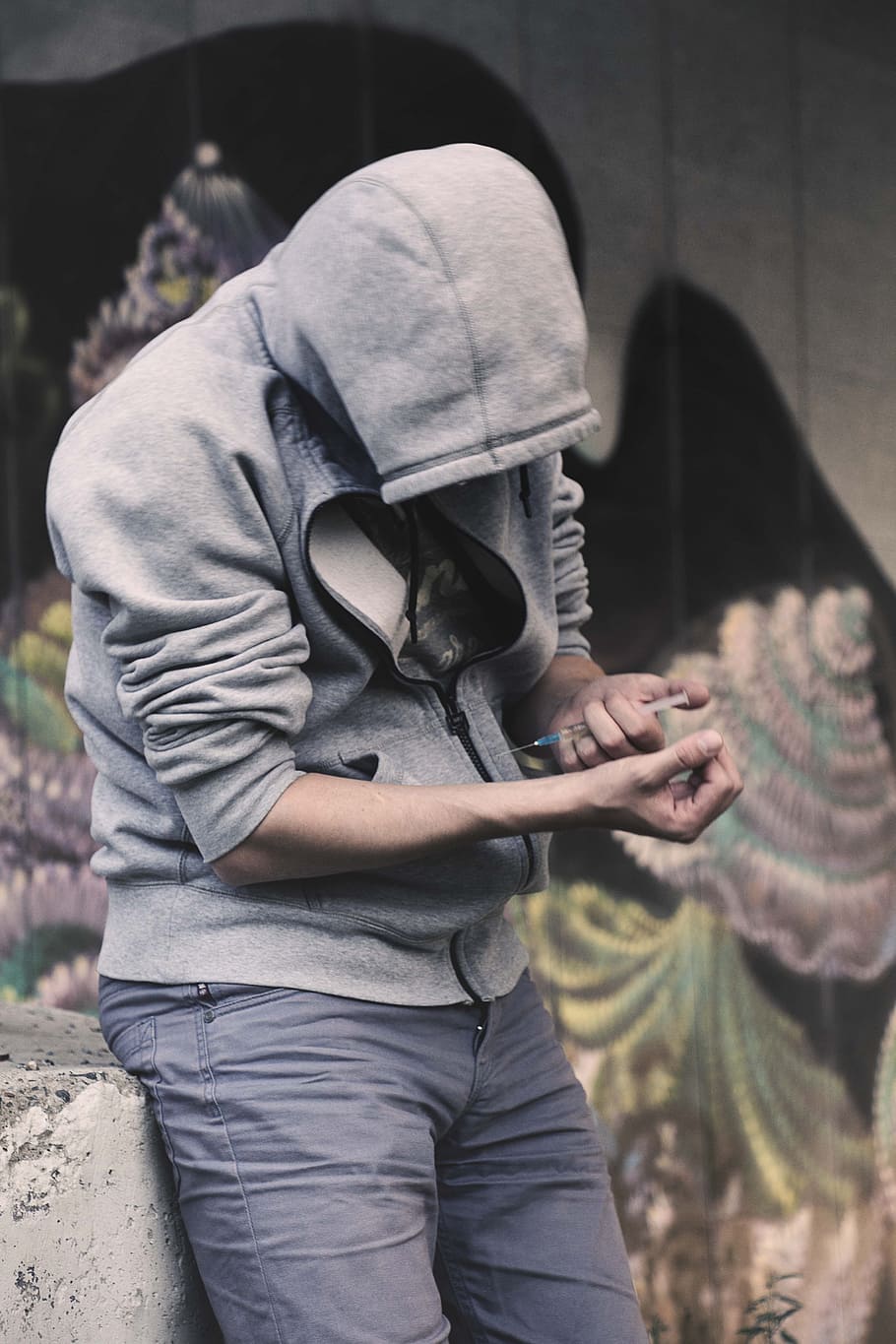 person holding injection wearing gray zip-up hoodie during daytime, HD wallpaper