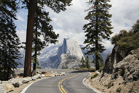 gray concrete road during daytime, mountain in-front road, yosemite HD wallpaper