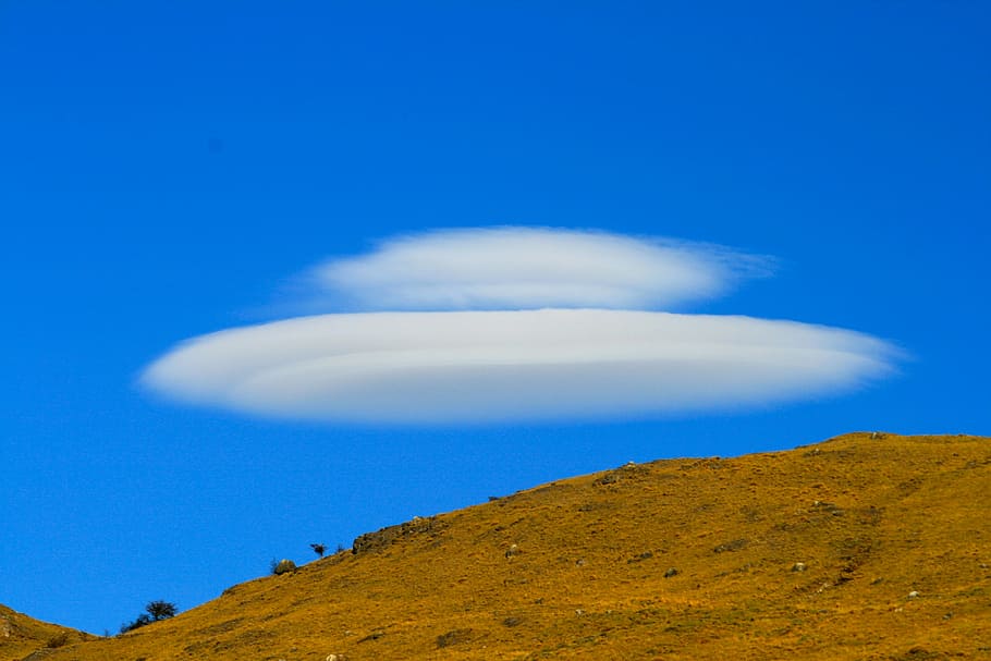 brown cliff under cloudy sky, space, ufo, nature, blue, mountain HD wallpaper