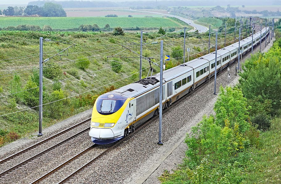 yellow and gray bullet train on railway, eurostarzug, paris - london
