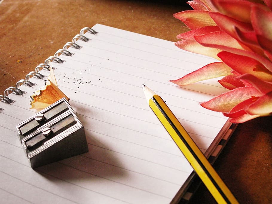 photo of pencil and grey sharpener on notebook, writing, notes HD wallpaper