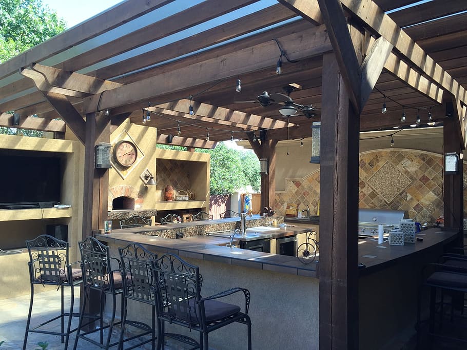 brown and gray wooden gazebo, patio cover, outdoor kitchen, tile