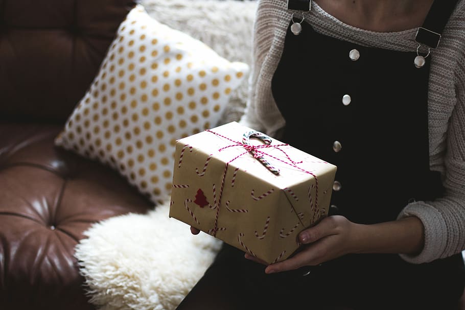 selective focus photography of woman holding gift box, person holding gift box HD wallpaper