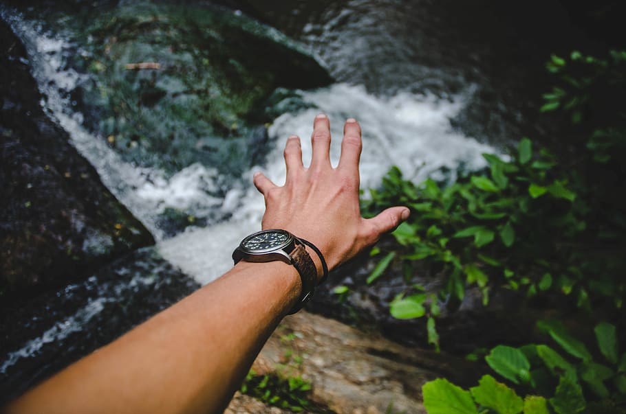 The Watcherfall, person showing arm wearing watch over water stream HD wallpaper