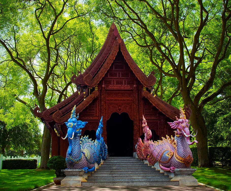 Chinese temple surrounded by green leaf trees, mythical creatures HD wallpaper