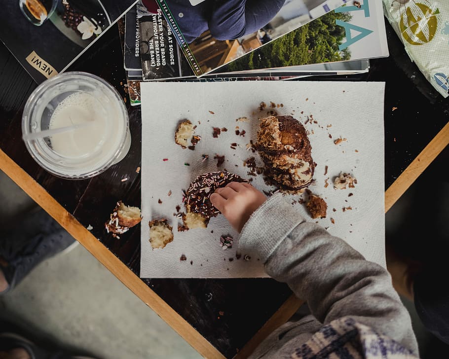 child eating desert, person eating pastry food, hand, donut, milk HD wallpaper