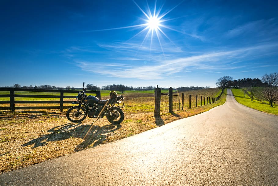 black backbone motorcycle parked near road and green grass field, HD wallpaper