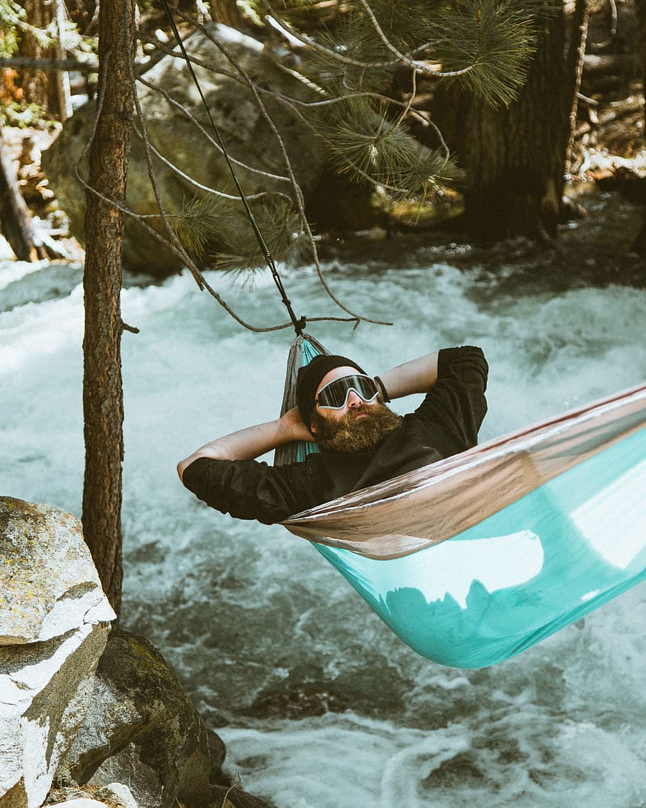 man reclining on blue and brown hammock, Hanging Out Over the River HD wallpaper