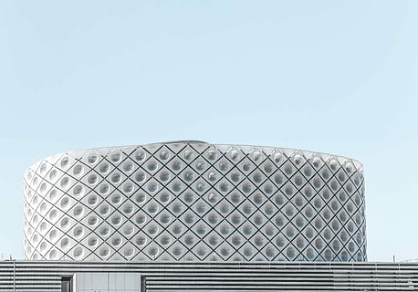 photo of white building, round gray concrete building under clear sky HD wallpaper