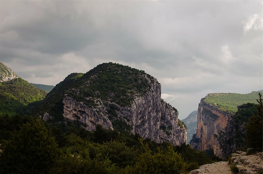 mountain terrain under white cloudy skies, aerial, photography HD wallpaper