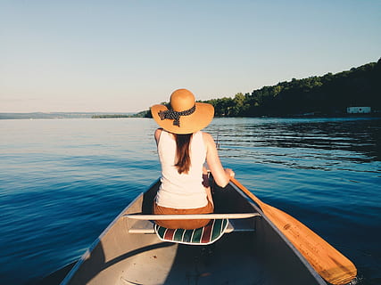 woman wearing sunhat riding boat on body of water, woman in kayak paddling in body of water HD wallpaper